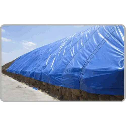 Long stack covered with blue waterproof tarpaulin