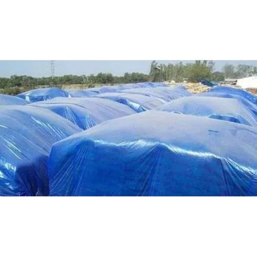 Blue tarpaulins covering produce stored outdoors